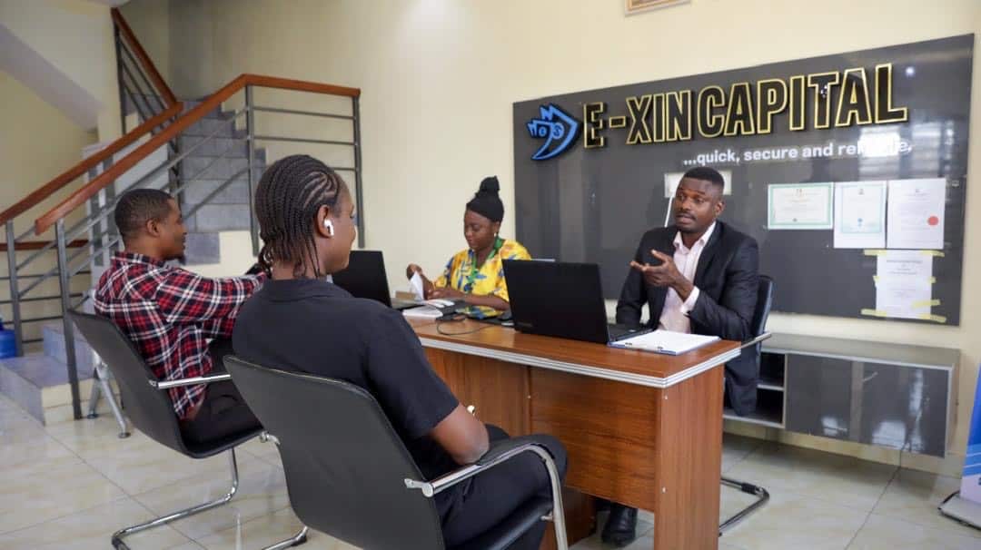 E-XIN Capital branded office signage and certifications, Ikeja